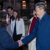 Chinese delegation shaking hands with Edinburgh member of staff